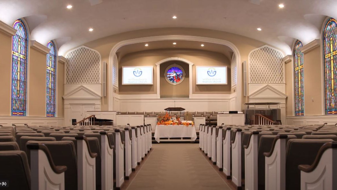 An empty church sanctuary, wired with a complete sound system, working well together because of well-designed audio integration.