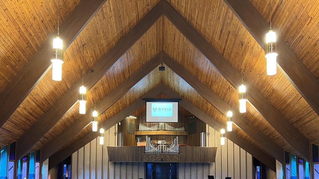 A beautiful peaked wooden ceiling creates a beautiful sound in a church hall.