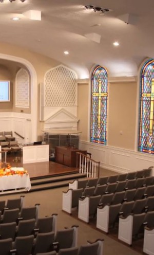 An image of a church sanctuary with high ceilings and many hard surfaces creates potential problems for church acoustics.